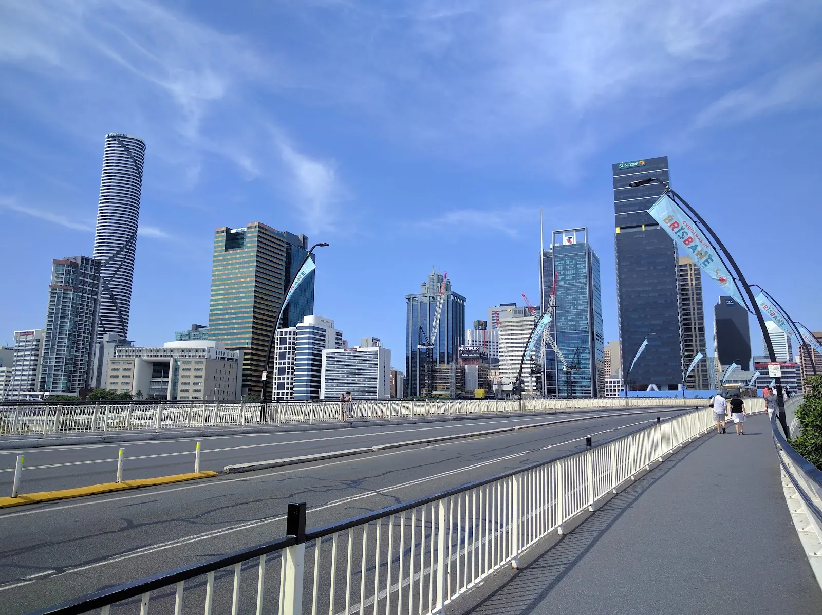 Brisbane city buildings seen from a bridge walkway