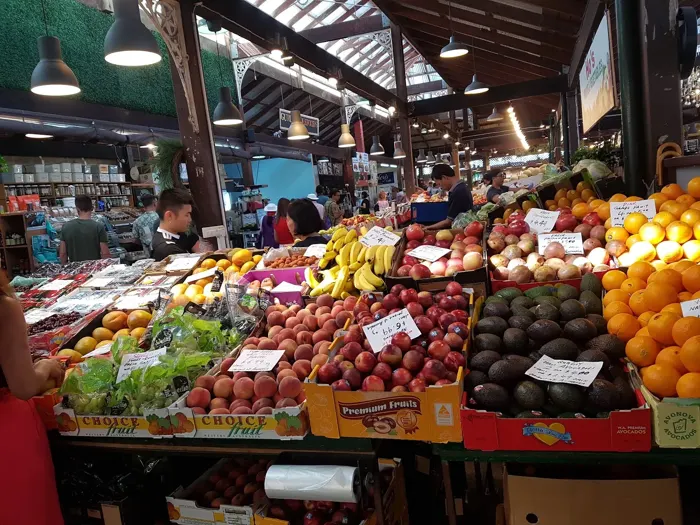 A colourful produce stall inside a Perth market