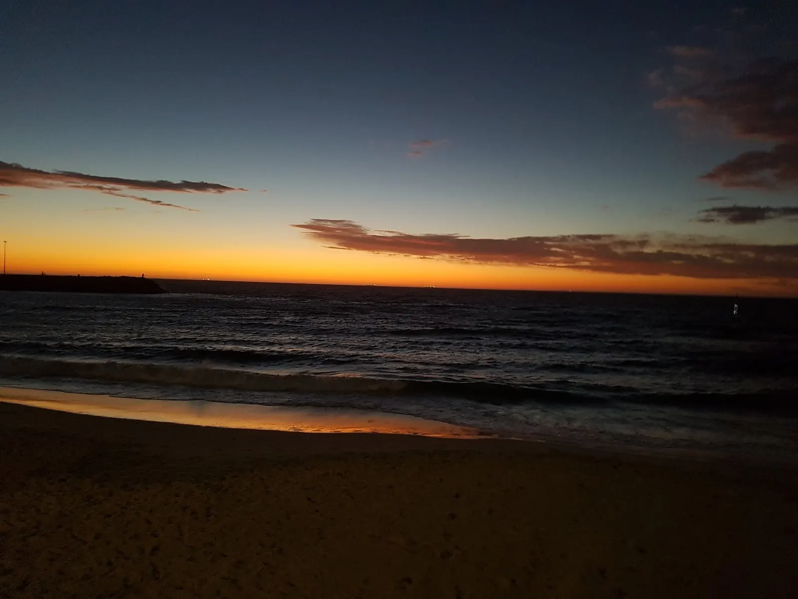 An orange sunset above the coast near Perth