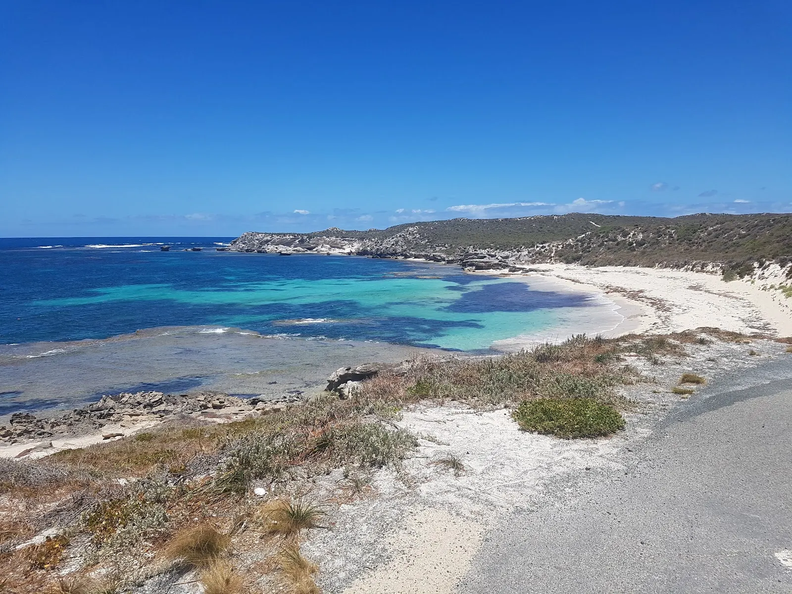 Turquoise water beside a rocky cove on Rottnest Island