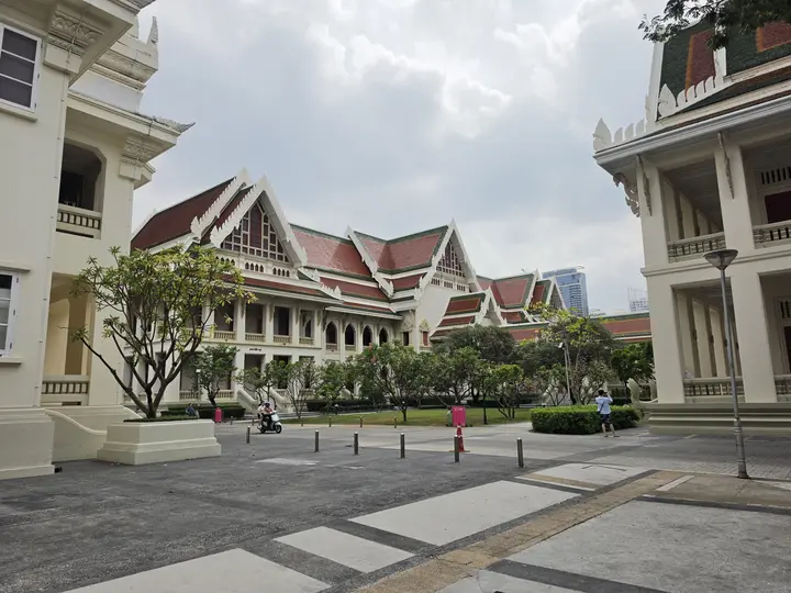 White Thai-style buildings with tiered roofs in Pathum Wan, Bangkok