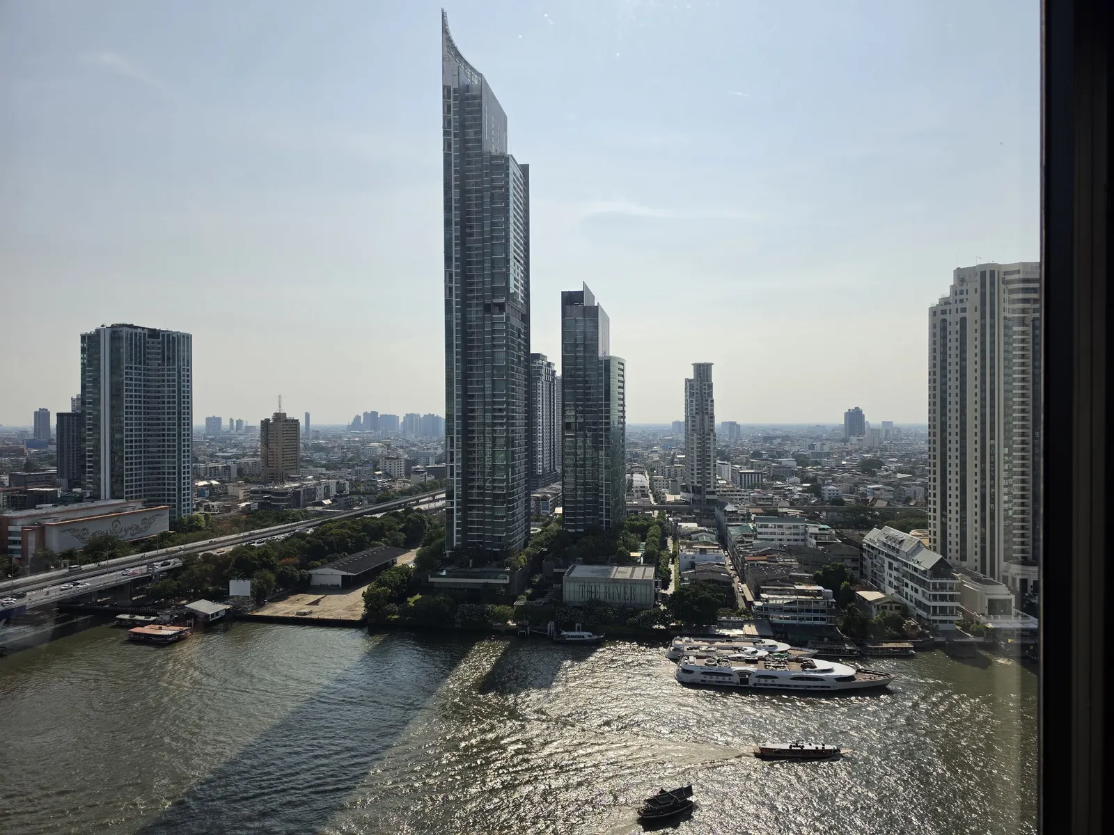 Towers along the Chao Phraya river in the afternoon