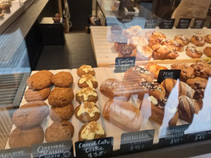 Trays of buns and pastries in a bakery window in SoHo