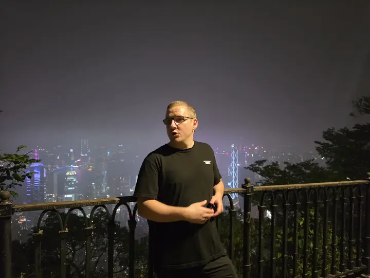 Jeremy at a lookout over the city at night