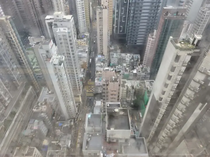 Tall residential towers packed together under cloud in Hong Kong