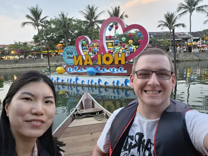 Selfie of Jeremy and his travel companion on the river in Hoi An